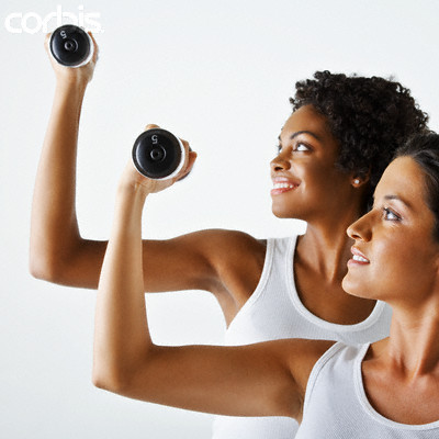Two Women Exercising With Weights